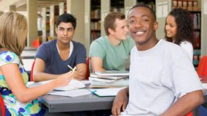 5 students sitting at a table